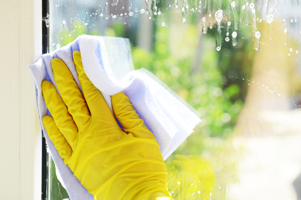 cleaning glass window with cloth
